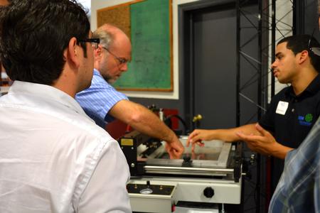 Hands-on instruction during a recent paste-place-reflow workshop at DDM Novastar.